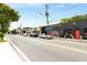 Street view of businesses with ample parking and pedestrian seating areas along a tree-lined street at 1068 Shelby Se Pl, Atlanta, GA 30316