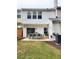 Backyard patio with outdoor seating and green lawn at 10900 Wittenridge Dr # H8, Alpharetta, GA 30022