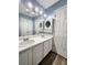 Spacious bathroom featuring double sinks, ample counter space, and white cabinets at 10900 Wittenridge Dr # H8, Alpharetta, GA 30022