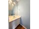 Well-lit half bathroom with a sleek vanity and classic fixtures at 10900 Wittenridge Dr # H8, Alpharetta, GA 30022