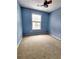 Bedroom with a large window that brings in natural light and a ceiling fan at 10900 Wittenridge Dr # H8, Alpharetta, GA 30022