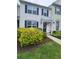 Charming home with well-maintained landscaping featuring vibrant greenery and a cozy front porch at 10900 Wittenridge Dr # H8, Alpharetta, GA 30022