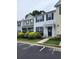 Inviting home featuring classic shutters, a cozy front porch, and easy parking access at 10900 Wittenridge Dr # H8, Alpharetta, GA 30022