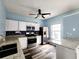 Well-equipped kitchen featuring stainless steel appliances, granite countertops, and modern white cabinets at 10900 Wittenridge Dr # H8, Alpharetta, GA 30022