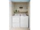 Laundry closet equipped with a washer, dryer, and overhead shelving at 10900 Wittenridge Dr # H8, Alpharetta, GA 30022
