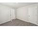 Bedroom featuring two doors that allows easy access to other areas at 11850 Rizvan Pl, Covington, GA 30014