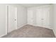 Carpeted bedroom featuring two closets for ample storage space at 11850 Rizvan Pl, Covington, GA 30014