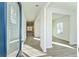 Inviting entryway features wood-look floors, neutral walls, and an open floor plan at 11850 Rizvan Pl, Covington, GA 30014
