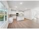 Kitchen with granite countertop island, pendant lights, and stainless steel appliances at 11850 Rizvan Pl, Covington, GA 30014