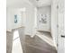 Bright living area with wood-look floors, neutral walls, large windows, and ample natural light at 11850 Rizvan Pl, Covington, GA 30014