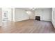 Spacious living room features a fireplace, wood-look floors, and an open layout at 11850 Rizvan Pl, Covington, GA 30014