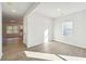 Sunlit living room showcasing wood floors and an airy, open feel at 11850 Rizvan Pl, Covington, GA 30014