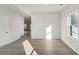 Inviting living room with sleek floors and plenty of natural light at 11850 Rizvan Pl, Covington, GA 30014