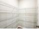 Convenient pantry showing a custom shelving system for organized storage at 11850 Rizvan Pl, Covington, GA 30014