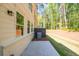 Backyard features a concrete patio and a view of the wooded area at 1624 Ruskin Way, Marietta, GA 30062