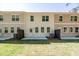 Backyard view of townhomes with patios and green space at 1624 Ruskin Way, Marietta, GA 30062
