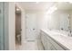 Elegant bathroom featuring double sinks with quartz countertops and marble floors at 1624 Ruskin Way, Marietta, GA 30062