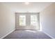 Bedroom has two windows that let in natural light with a neutral color scheme at 1624 Ruskin Way, Marietta, GA 30062