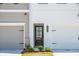 Close-up of townhome entrance highlighting the architectural details, front door, and address number at 1624 Ruskin Way, Marietta, GA 30062