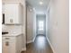 Hallway with white walls and ceilings, and light wood look plank flooring at 1624 Ruskin Way, Marietta, GA 30062