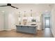 Bright and open kitchen with island, stainless appliances, and modern pendant lighting at 1624 Ruskin Way, Marietta, GA 30062