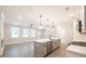 Open-concept kitchen with island, stainless appliances, and views of the living area at 1624 Ruskin Way, Marietta, GA 30062