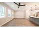 Bright living room with hardwood floors, ceiling fan, recessed lights, and large windows at 1624 Ruskin Way, Marietta, GA 30062