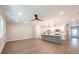 Spacious living area with an open layout and modern kitchen with stainless appliances at 1624 Ruskin Way, Marietta, GA 30062