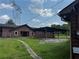 View of an open backyard with covered structure in a grassy area at 3105 Hamilton Mill Rd, Buford, GA 30519