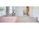Bright bedroom featuring a pink bed, white doors, and a glimpse of the bathroom at 42 Citrine Way, Acworth, GA 30101
