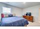 Bedroom with a blue bed and a dresser at 42 Citrine Way, Acworth, GA 30101