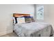 Comfortable bedroom with plush bedding, a soft blanket, and natural light from the window at 42 Citrine Way, Acworth, GA 30101