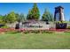 Community sign boasts beautiful landscaping and well-kept grounds, creating a welcoming entrance at 42 Citrine Way, Acworth, GA 30101