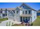 Stylish two-story home featuring a two-car garage, covered porch, and well-maintained landscaping at 42 Citrine Way, Acworth, GA 30101