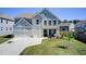 Charming two-story home with a manicured lawn, two-car garage, and inviting front porch at 42 Citrine Way, Acworth, GA 30101