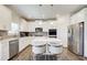 Bright, modern kitchen featuring stainless steel appliances, a center island, and stylish finishes at 42 Citrine Way, Acworth, GA 30101