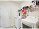 Functional laundry room with modern appliances, storage shelves, and ample space at 42 Citrine Way, Acworth, GA 30101