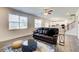 Bright living room with natural light, wood floors, comfortable seating, and open kitchen view at 42 Citrine Way, Acworth, GA 30101