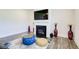 Cozy living room with a fireplace, TV, stylish decor, and modern flooring at 42 Citrine Way, Acworth, GA 30101