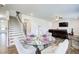 Open-concept living area with dining, staircase, and fireplace; perfect for entertaining at 42 Citrine Way, Acworth, GA 30101