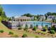 Enjoy the community pool and clubhouse with seating under a bright, sunny sky at 42 Citrine Way, Acworth, GA 30101