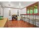 Finished basement bar with shelving, mini-fridge, bar seating, and lighting at 5837 Fox Run, Rex, GA 30273