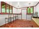 Finished basement with bar seating, serving counter, and exterior access at 5837 Fox Run, Rex, GA 30273