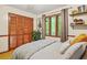 Bright bedroom features a comfy bed, closet, decor and window views at 5837 Fox Run, Rex, GA 30273
