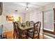 Cozy dining room featuring a chandelier, a dining set, a painting, and access to the backyard at 5837 Fox Run, Rex, GA 30273