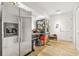 Kitchen area with stainless steel refrigerators, tile floors, white door and an abundance of storage spaces at 5837 Fox Run, Rex, GA 30273