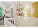 Open living area with view of the high ceiling and large windows, and overlooking the dining room at 5837 Fox Run, Rex, GA 30273