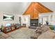 Cozy living room with a stone fireplace and vaulted ceilings, creating a comfortable atmosphere at 5837 Fox Run, Rex, GA 30273