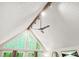 Bright living room featuring vaulted ceiling, large windows with backyard views, and modern ceiling fan at 5837 Fox Run, Rex, GA 30273