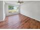 Bedroom with wood-look floors and natural light creates a warm and inviting space at 105 Odyssey Turn, Conyers, GA 30012